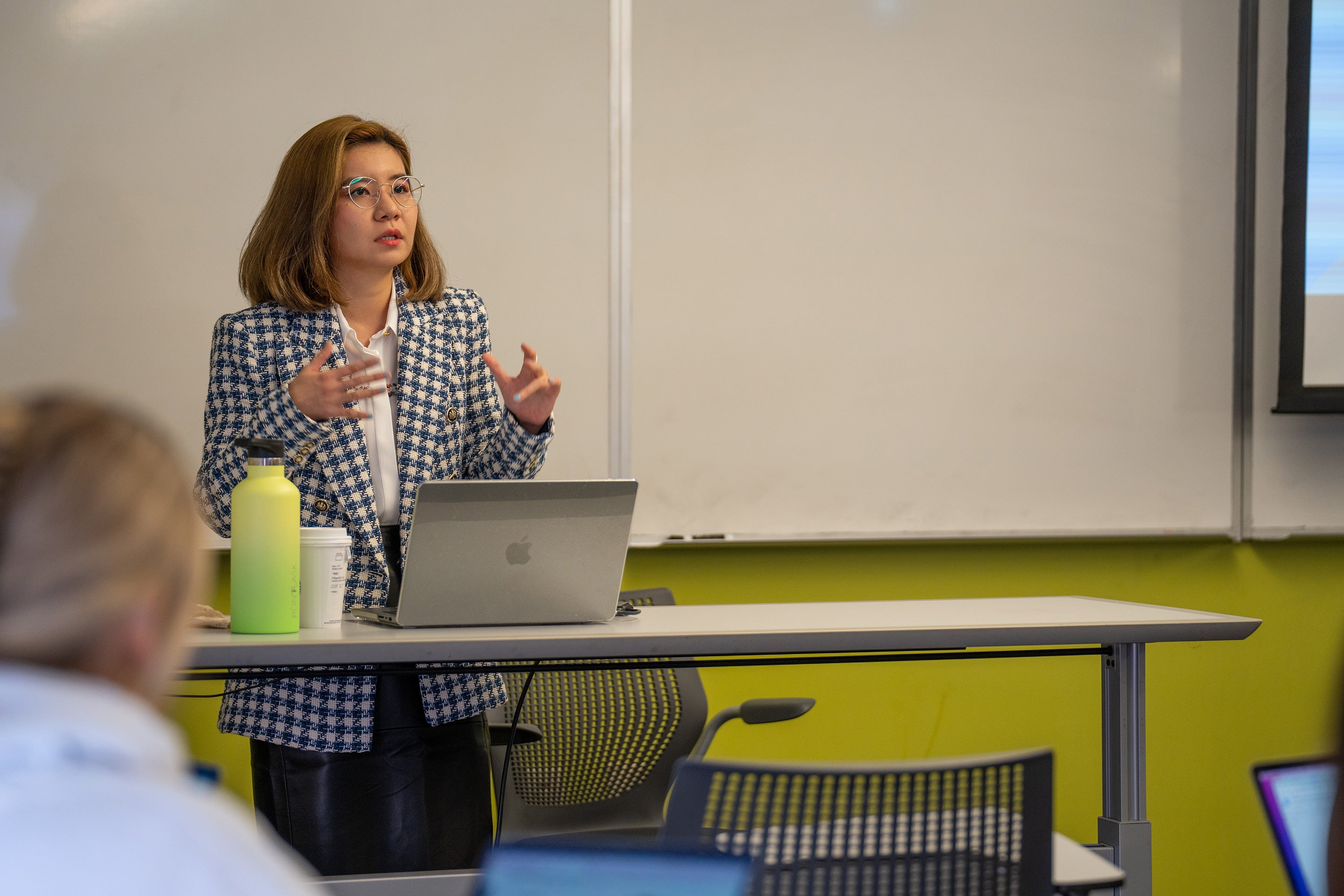 Professor Sally Lim giving a lecture in a classroom