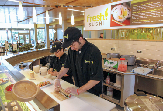 Chef rolling nama harumaki at Fresh Sushi food counter